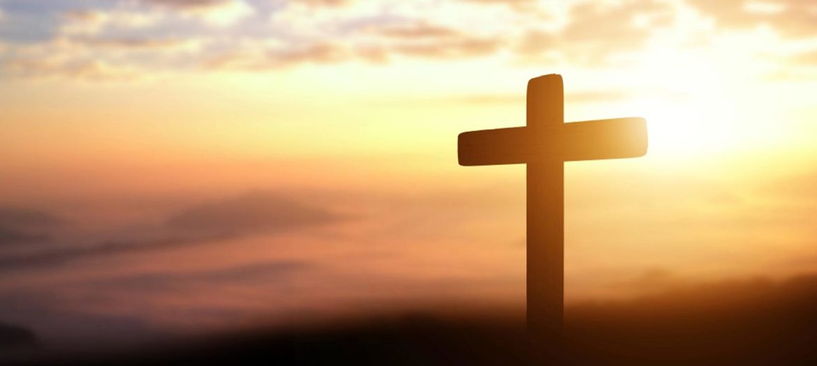 silhouette-of-catholic-cross-at-sunset-background-panorama-picture